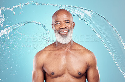 Buy stock photo Senior, water splash and portrait of a black man in studio shower for skincare and beauty. Smile, blue background and isolated elderly person with happiness for body cleaning and morning dermatology