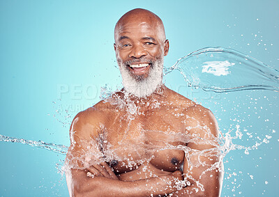 Buy stock photo Skincare, portrait and senior man in studio for beauty, grooming and water splash on blue background. Elderly, model and guy relax while cleaning, hygiene and skin wellness, hydration and isolated