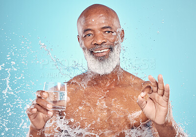 Buy stock photo Splash, portrait and elderly man in a studio with a glass of water and a ok hand gesture. Health, wellness and happy senior African male with sign language by a blue background with mockup space