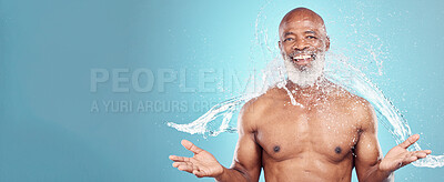 Buy stock photo Portrait, old man and water splash in studio for beauty, grooming and skincare on blue background. Elderly, model and guy relax while cleaning, hygiene and skin wellness, hydration and isolated