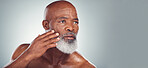 Skincare, grooming and face of black man for wellness, haircare and healthy skin on gray background. Beauty mockup, advertising and senior male pose for beard care, facial treatment and dermatology