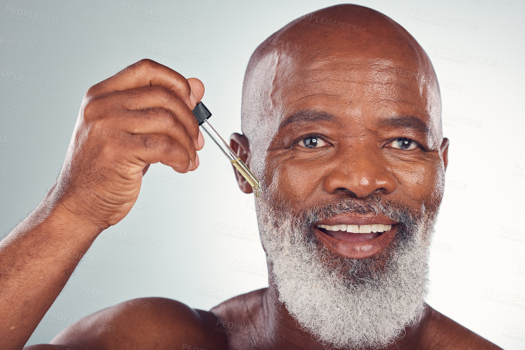 Buy stock photo Cosmetics, black man and serum for skincare, dermatology and guy on grey studio background. African American male or senior gentleman with collagen, oil and treatment for natural beauty or anti aging