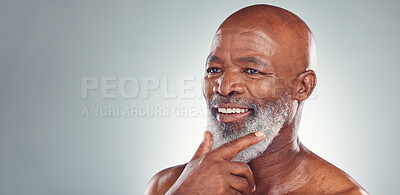 Buy stock photo Senior black man, smile and beard in skincare for facial treatment, cosmetics or thinking on mockup. Happy elderly African American male smiling face in satisfaction against a grey studio background