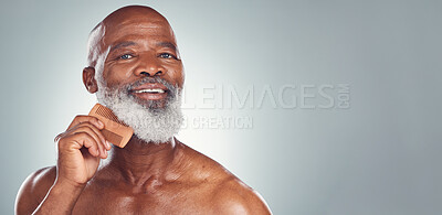 Buy stock photo Grooming, comb and beard with face of black man for beauty, hygiene and skincare with mockup. Self care, facial hair and barber with model for health, wellness and cleaning in studio background