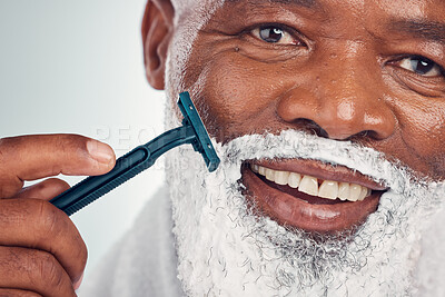 Buy stock photo Black man, face zoom and shaving cream with razor, portrait for beauty and grooming isolated on studio background. Facial hair removal, happy elderly person and hygiene with skincare and wellness