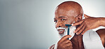 Black man, beard and shaving face in skincare for grooming, self care or facial treatment on mockup. African American male smiling for clean hygiene, shave and cream with razor on a gray background