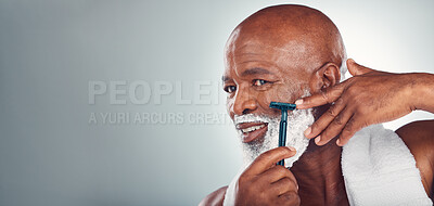 Buy stock photo Black man, beard and shaving face in skincare for grooming, self care or facial treatment on mockup. African American male smiling for clean hygiene, shave and cream with razor on a gray background