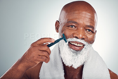 Buy stock photo Black man, face and cream to shave with razor, portrait for beauty and grooming isolated on studio background. Facial hair removal, happy elderly person and hygiene with skincare and wellness