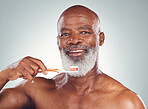 Dental care portrait, senior man and morning toothbrush for oral hygiene in studio for wellness. Gray background, happy face and elderly person with teeth cleaning product and toothpaste product