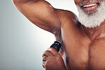 Mock up, black man and armpit with deodorant, smile and body care grooming isolated on grey background. Skincare, health and happy senior male with skin product for cleaning and wellness in studio.