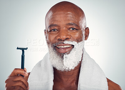 Buy stock photo Black man, face and shaving cream with razor, portrait for beauty and grooming isolated on studio background. Facial hair removal, happy elderly person and hygiene with skincare and wellness