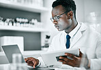 Science, research and black man with tablet and laptop for medical report, analytics and test results. Biotechnology, healthcare and scientist with digital tech for data, lab study and innovation