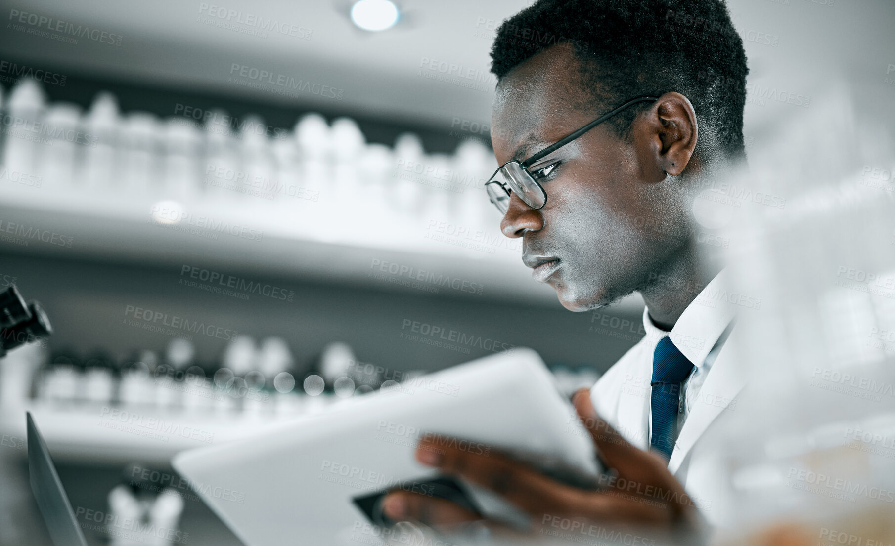 Buy stock photo Science, laboratory and black man with tablet for research, medical analysis and experiment results. Medicine, healthcare and scientist with digital tech for data analysis, lab study and innovation