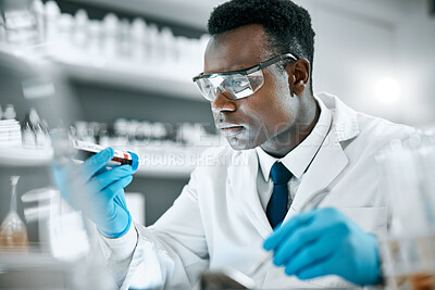 Buy stock photo Black man, research and tube for test sample, focus and thinking for cure, innovation and diagnosis. African American male, researcher or scientist with vial, data analysis or decision for experiment