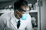 Covid, mask and scientist working in a lab for research on a pandemic for healthcare and medicine. Black man, technician and science professional or doctor learning cancer or epidemic development