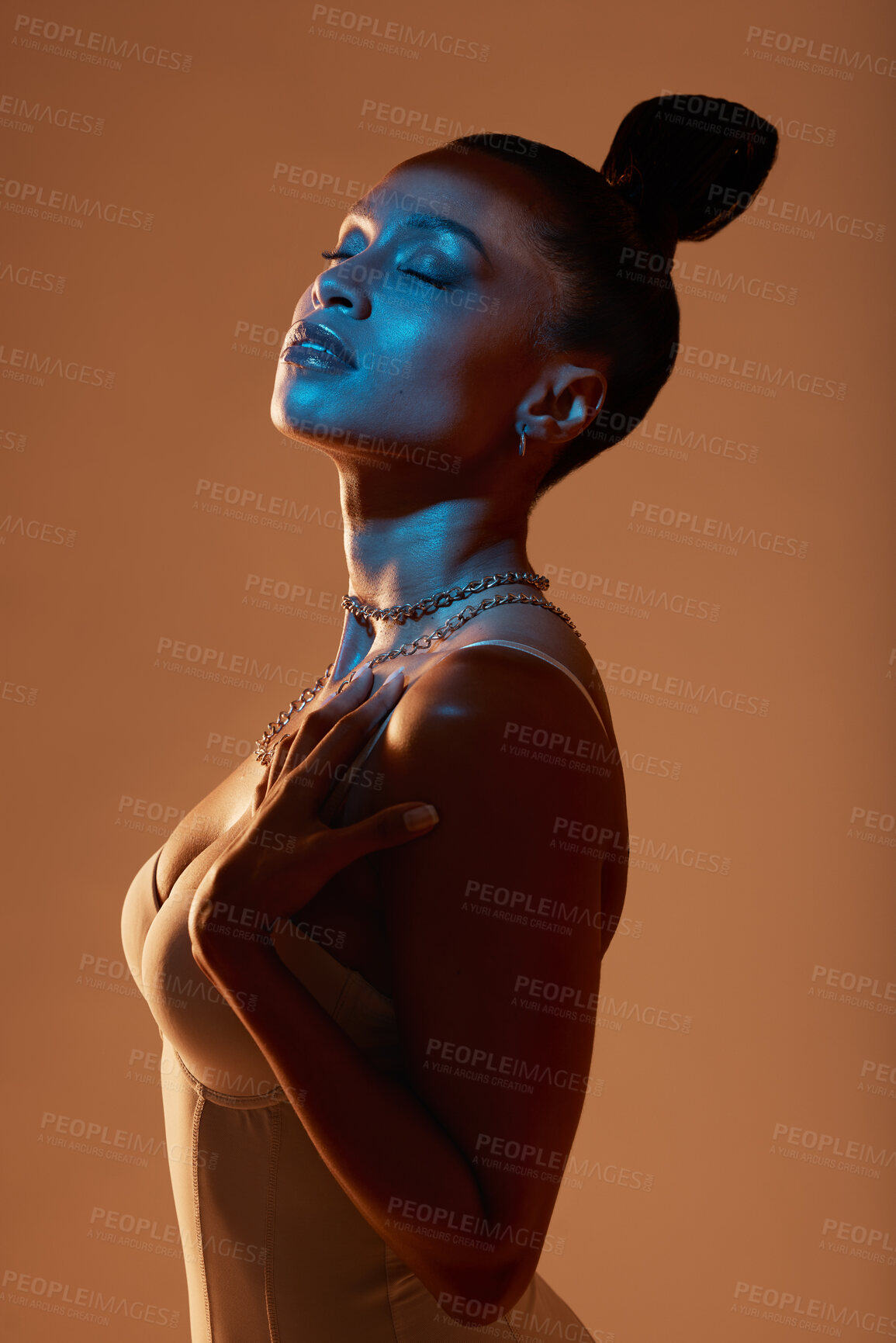 Buy stock photo Art light, beauty and black woman profile in underwear feeling sexy and mystical with studio lights. Brown background, isolated and face glow of a female model with blue lighting and glamour pose