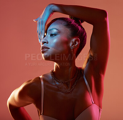 Buy stock photo Blue light, beauty and black woman profile feeling sexy and mystical with studio lights. Brown background, isolated and creative face glow of a female model with colorful lighting and glamour pose