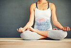 Lotus, hands and woman on a floor for meditation, relax and zen in studio, wellness and peace. Yoga, pose and girl in chakra, balance and energy training, exercise and posture alignment in a room