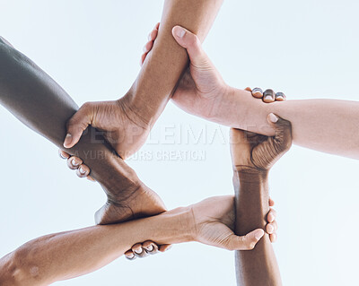 Buy stock photo Below, hands and team, sports and collaboration, partnership and huddle against sky background. Bottom, fitness and friends hand in support of teamwork, goal and mission, diversity and training 