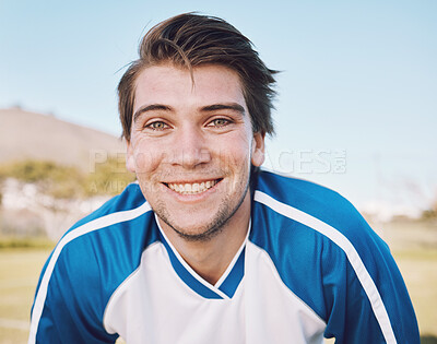 Buy stock photo Football player, portrait and smile on field for training, fitness and workout goals, mission and strategy on blue sky. Happy soccer athlete, person or man face for contest, game and outdoor sports