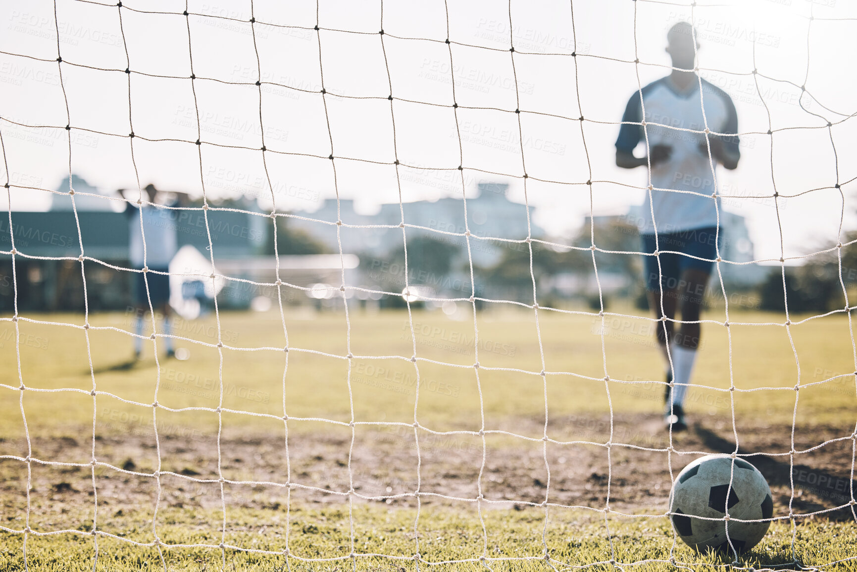 Buy stock photo Sports, soccer and ball in net after goal, score and winning on field for training, practice and game match. Motivation, football club mockup and players outdoors for fitness, exercise and workout