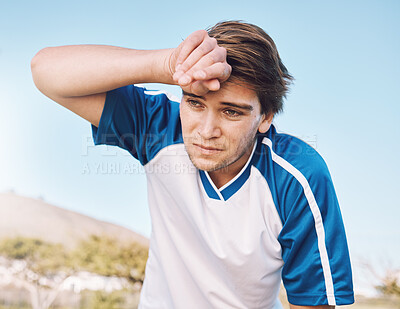 Buy stock photo Man, tired with face and soccer player on outdoor field, playing game or football training with energy and exhausted athlete. Team sport, sweating and fitness, challenge and fatigue with workout