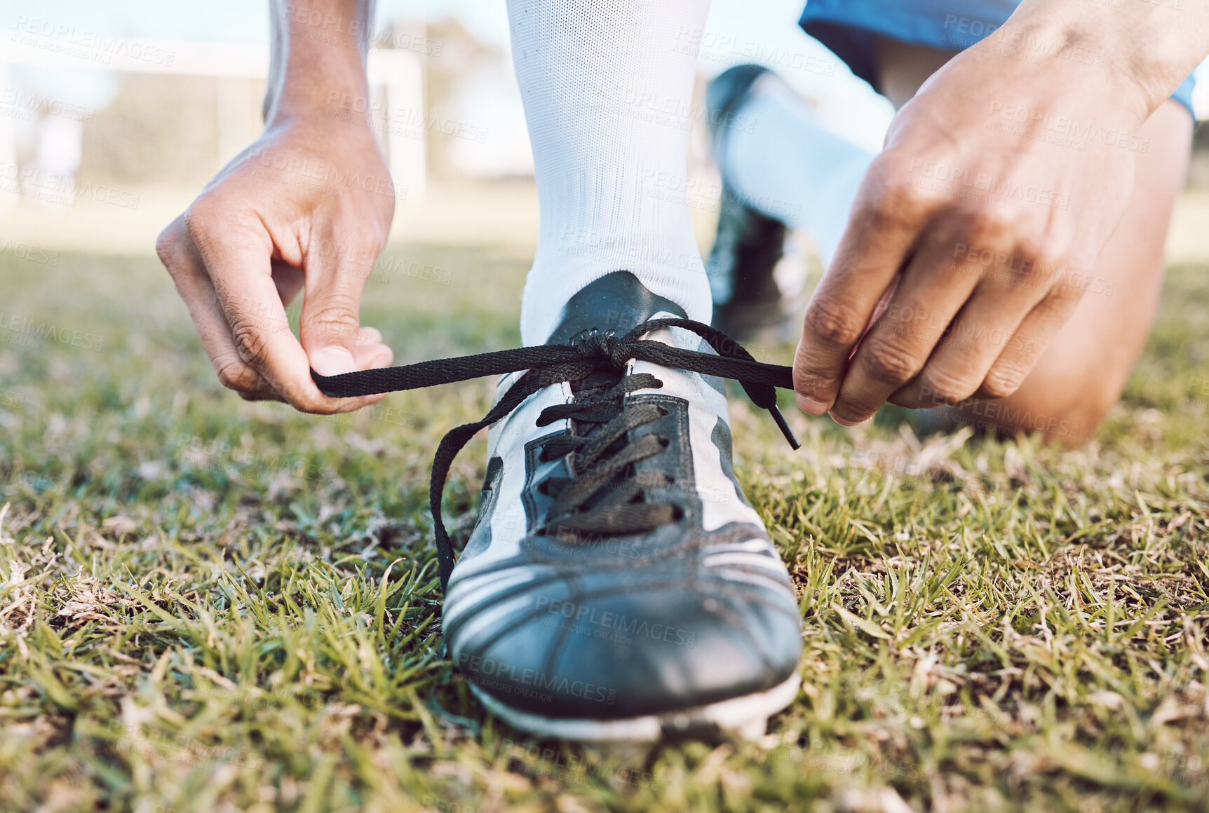 Buy stock photo Sports, soccer field and man tie shoes for game, ready for training, workout and fitness outdoor. Male, guy or athlete tying shoe lace, before practice or exercise for wellness, cardio or competition