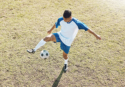 Buy stock photo Football, soccer ball and athlete doing sports cardio, training and exercise on a grass field. Kick, game and workout outdoor with fitness and running for wellness and health for game with energy