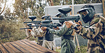 Team, paintball and target practice at shooting range in preparation for extreme sports match or game outdoors. Group of people, soldiers or army aiming to shoot for training before sport competition