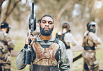 Paintball, gun and portrait of black man in park ready for games, match and shooting battle outdoors. Extreme sports, adventure and male in camouflage, military clothes and action gear for arena