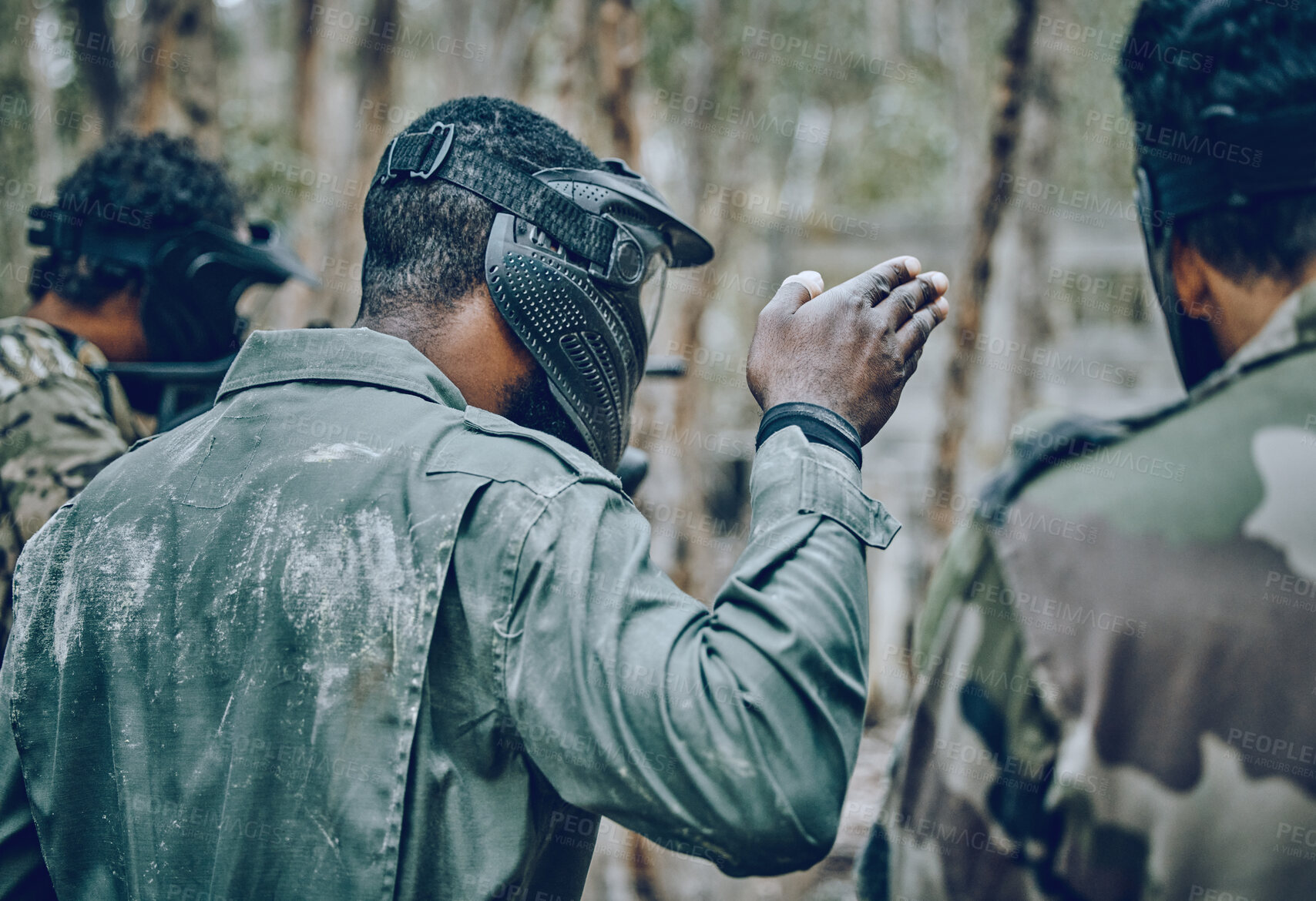 Buy stock photo Training, paintball and man with hand sign for planning, strategy and plan of action outdoor. Military, men and hands by guy leading team in sports, shooting and intense target practice together