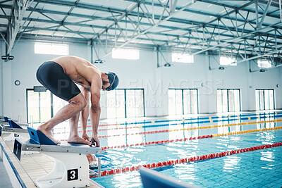 Buy stock photo Sports, swimming and man on podium by pool for training, exercise and workout for competition at gym. Fitness, wellness and professional male swimmer ready for dive, jump and race on diving board