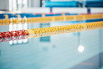 Pool, lanes in water for competition or racing lines for fitness or underwater sports empty with reflection. Exercise, workout and fresh, clear swim training arena lanes for swimming race with nobody