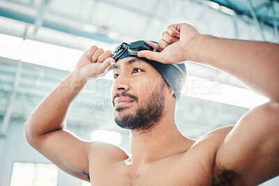 Swimming athlete, man and start race, fitness and exercise at pool, motivation and active lifestyle. Water sports, determination and face with workout, training and health with wellness in sport