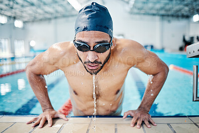 Buy stock photo Tired, breathing and man swimming for fitness, training and race in a stadium pool. Strong, sports and face of an athlete swimmer doing cardio in the water for a workout, sport and competition