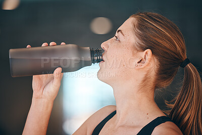 Buy stock photo Fitness, break and woman athlete drinking water for thirst, hydration and health in a training studio. Sports, wellness and young female enjoying a healthy cold beverage after a workout or exercise.