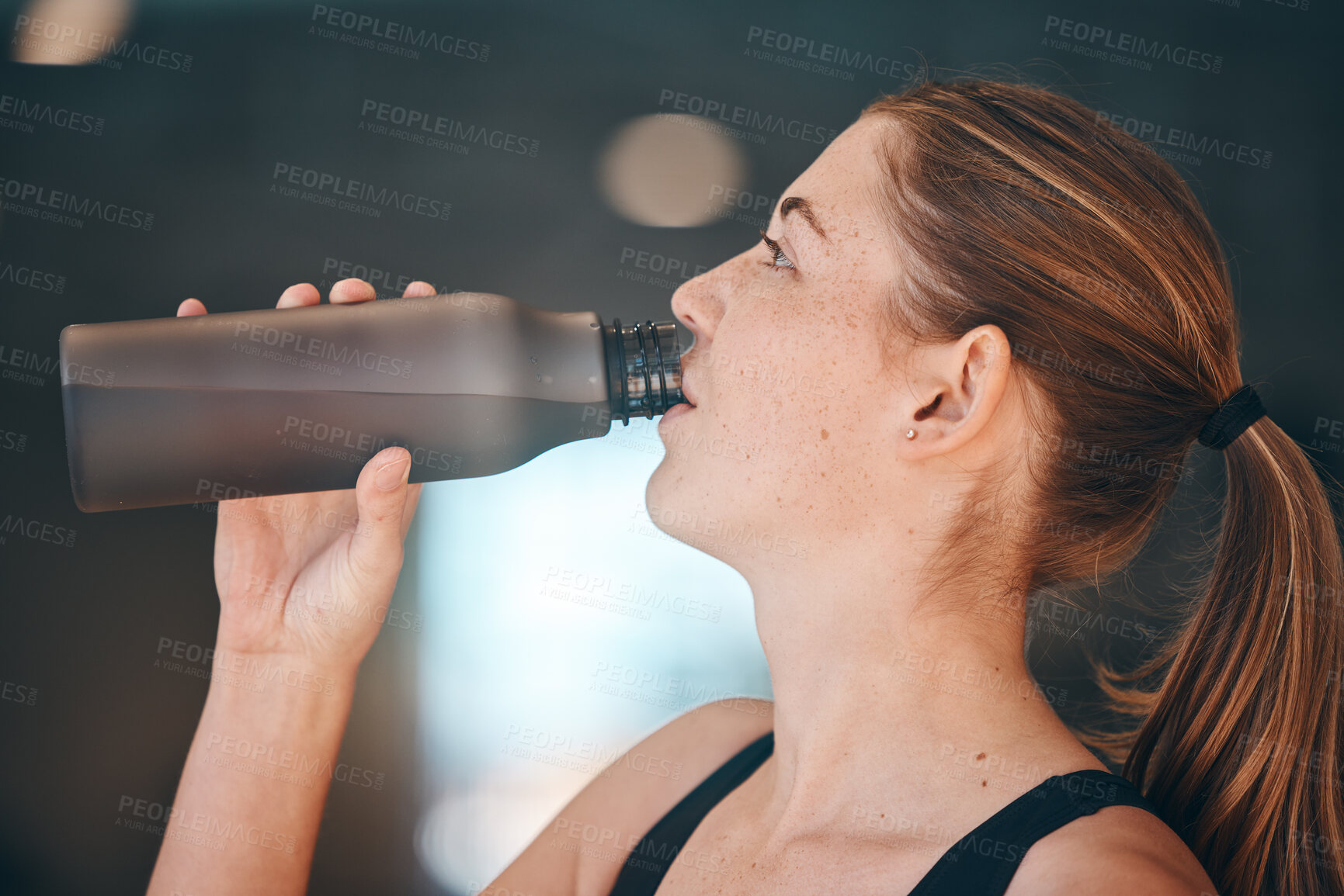 Buy stock photo Fitness, break and woman athlete drinking water for thirst, hydration and health in a training studio. Sports, wellness and young female enjoying a healthy cold beverage after a workout or exercise.