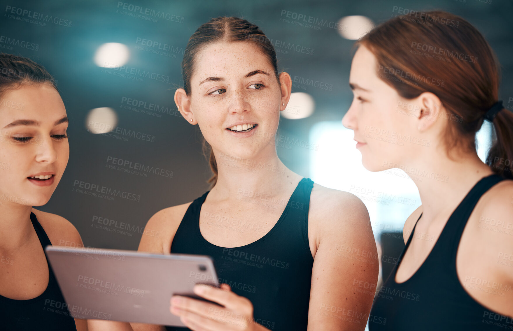 Buy stock photo Sports, tablet and team talking, workout plan and research for routine, training and exercise in gym. Women, female athletes or healthy girls with device, conversation or online schedule for practice