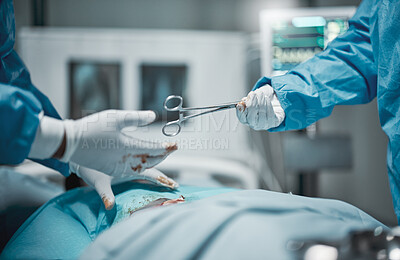 Buy stock photo Healthcare, cutting and hands giving scissors during a surgery, hospital work and service on patient. Teamwork, help and surgeon with a tool during a medical procedure, operation and career at clinic