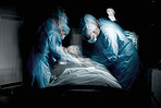 Healthcare, surgery and team of surgeons working on a patient for an emergency operation in the hospital. Medical, blur motion and group of doctors operating in a surgical room in the medicare clinic