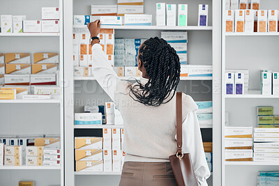 Buy stock photo Pharmacy, black woman and pills stock of a customer shopping for medicine, wellness cream or product. Female back, shop and drugs clinic with a person looking for health, medical and shelf products