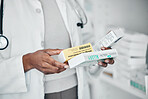 Pharmacy, healthcare and hands with pills, medicine and and medication for prescription in clinic. Wellness, pharmaceutical service and black woman with product box for drugs, vitamins and treatment