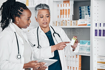 Buy stock photo Pharmacy, inventory and women on digital tablet for prescription, label and information check. Pharmacist, colleagues and ladies online, internet and search while doing stock at a clinic dispensary 