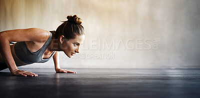 Buy stock photo Woman, fitness and pushups on mockup for exercise, workout or intense training on floor. Sporty female lifting body off the ground with arm strength in motivation for healthy cardio or exercising