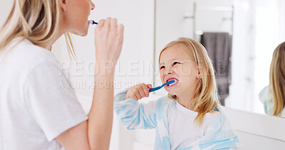 Buy stock photo Mom, girl kid and brushing teeth in bathroom, learning and support with foam for wellness in family house. Toothbrush, mother and daughter with toothpaste, teaching and health with cleaning mouth