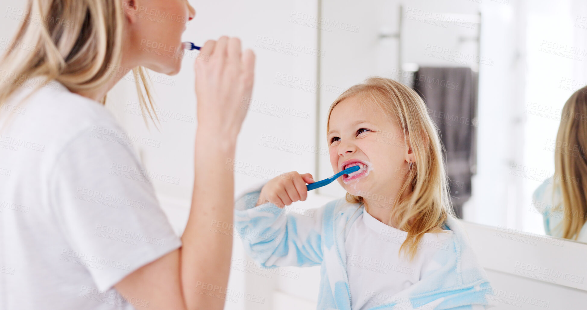 Buy stock photo Mom, girl kid and brushing teeth in bathroom, learning and support with foam for wellness in family house. Toothbrush, mother and daughter with toothpaste, teaching and health with cleaning mouth