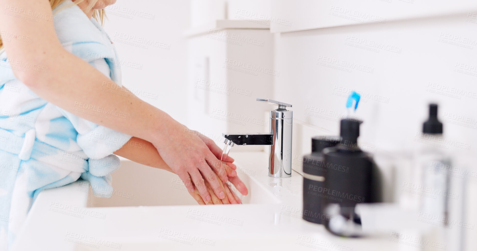 Buy stock photo Mom, girl and wash hands in bathroom with soap, hygiene and health in family home, water and faucet. Cleaning palm, mother and daughter with safety, stop bacteria or virus at sink, basin and learning