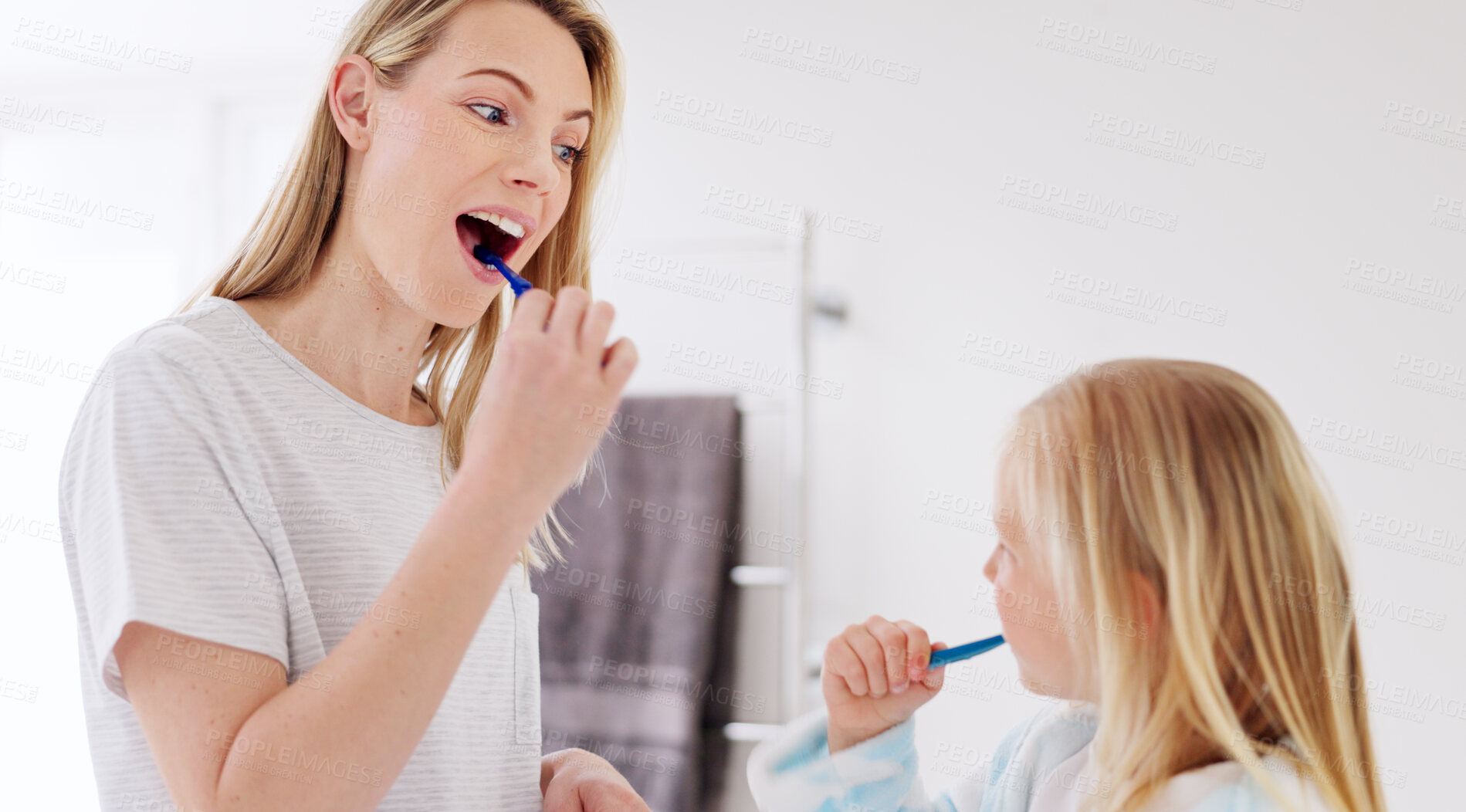 Buy stock photo Mom, girl child and brushing teeth in bathroom, learning and learning with foam for wellness in family house. Toothbrush, mother and daughter with toothpaste, teaching and cleaning mouth for health