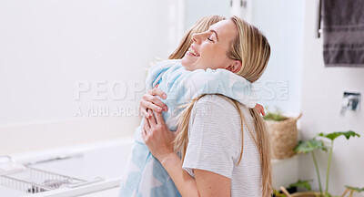 Buy stock photo Girl, mother and bathrobe in a bathroom for cleaning, wellness and hygiene in their home together. Children, washing and woman help child with gown after shower, bond and relax while talking. Mother and child hug