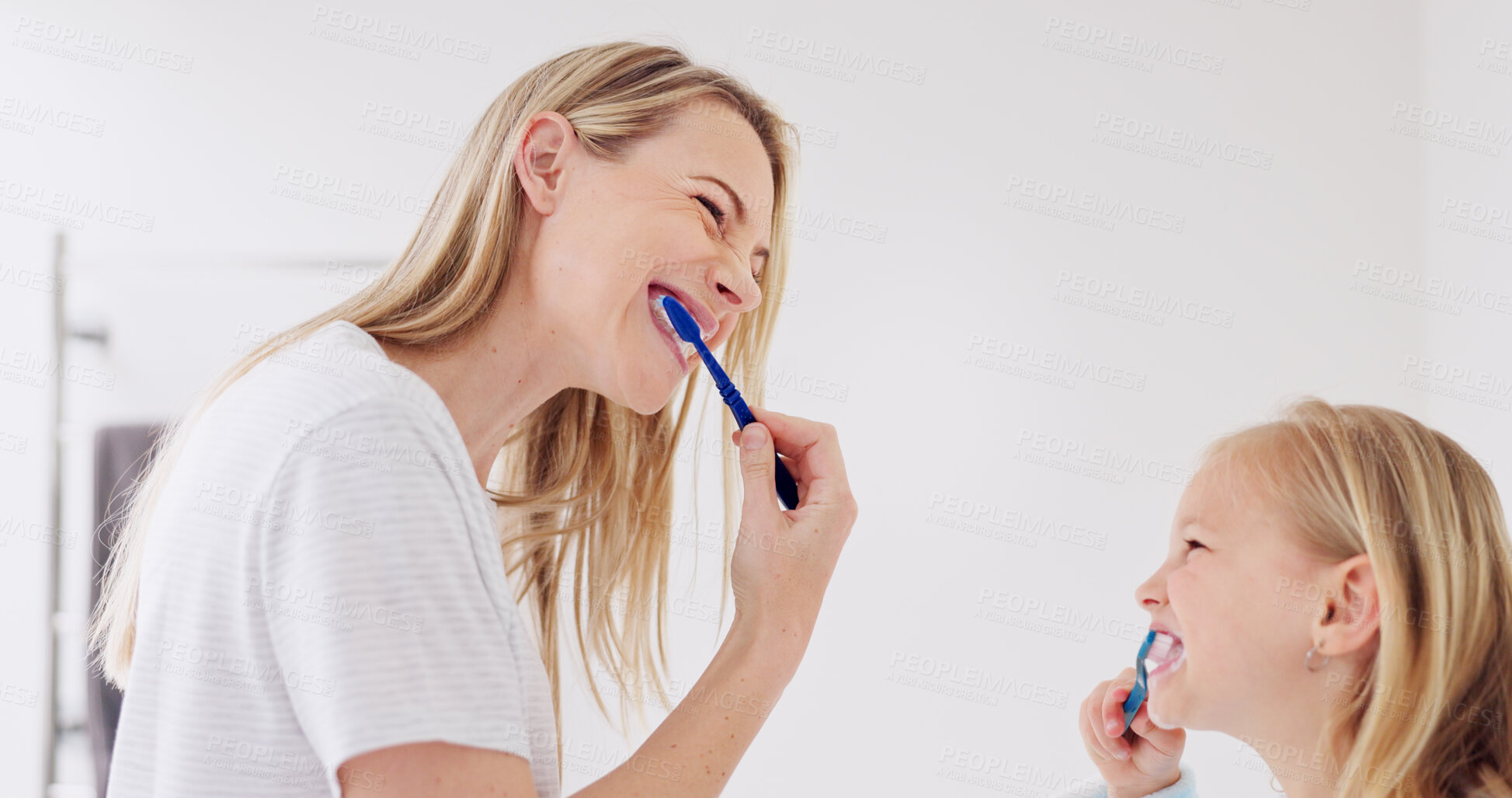 Buy stock photo Happy mom, girl child and brushing teeth in bathroom, learning and care with foam for wellness in family house. Toothbrush, mother and daughter with toothpaste, teaching or cleaning mouth for health